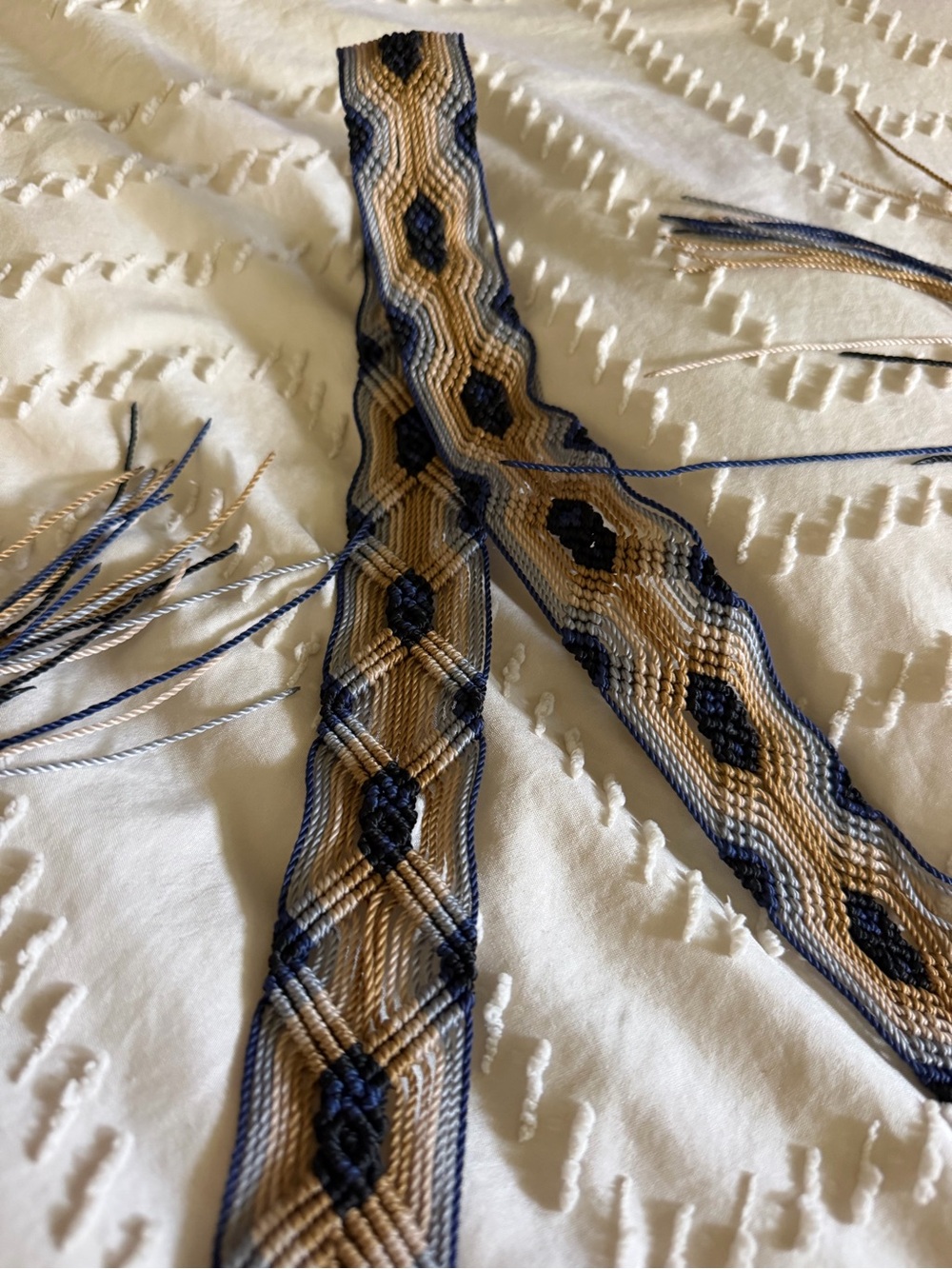 Women's navy and tan woven belt, handcrafted. 33 inches